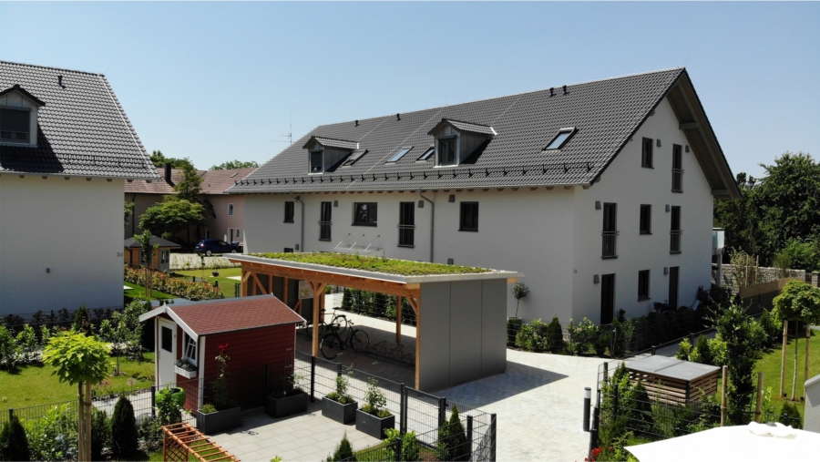 Traumhaus auf Erbpacht! Modernes, hochwertiges Reihenmittelhaus (KFW 55) frei zur Eigennutzung - Blick durch die Anlage